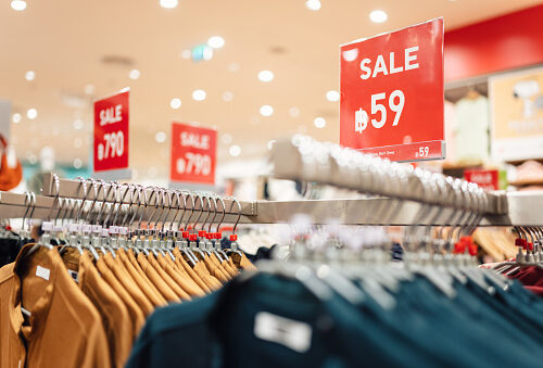 Discount price prototion 59% sign display in fashion department store during sale season period. End of Sale offering special promotion in shopping mall, department store background.